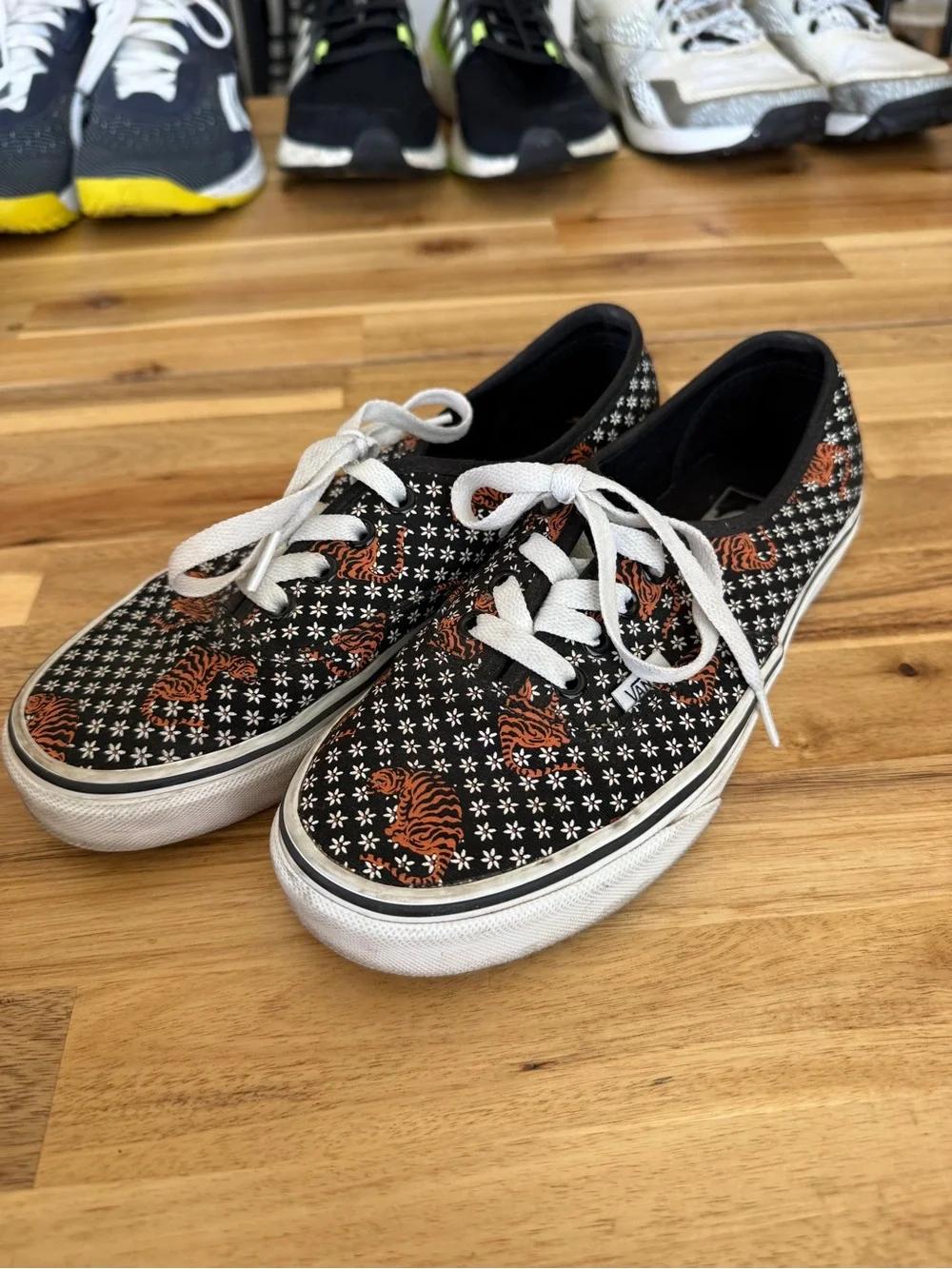 Black womens Lace-Up Canvas Vans with Orange Tiger Print
